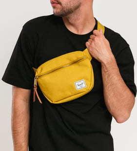 The Herschel Supply CO. Fifteen Hip Pack tmavě žlutá