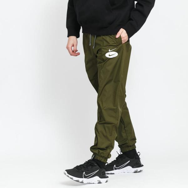 Šusťáky Nike M NSW Swoosh League Woven Lined Trousers olivové