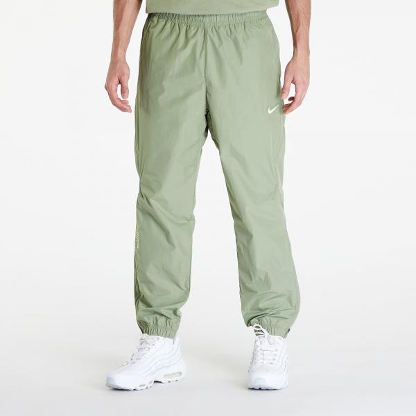 Kalhoty Nike x NOCTA Woven Track Pants Oil Green/ Light Liquid Lime XS