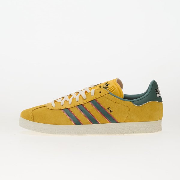 Tenisky adidas Gazelle Jamaica x Bob Marley Bold Gold/ None/ Pure Ruby EUR 39 1/3