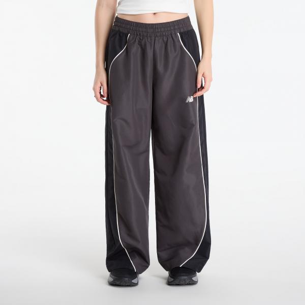Tepláky New Balance Trackside Woven Pant Black Cement S